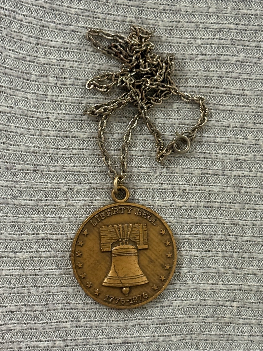 Vintage bronze tone round liberty bell pendant on silver tone chain necklace